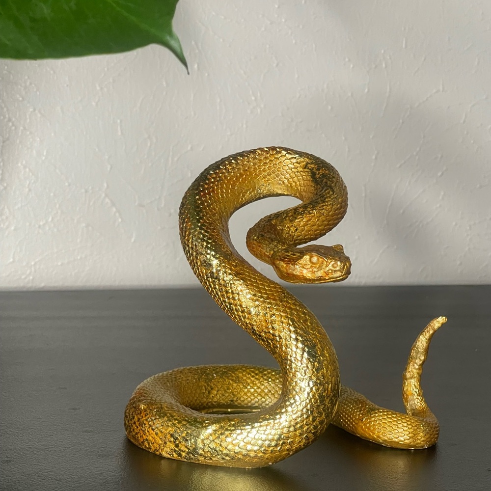 Gold paperweight snake
